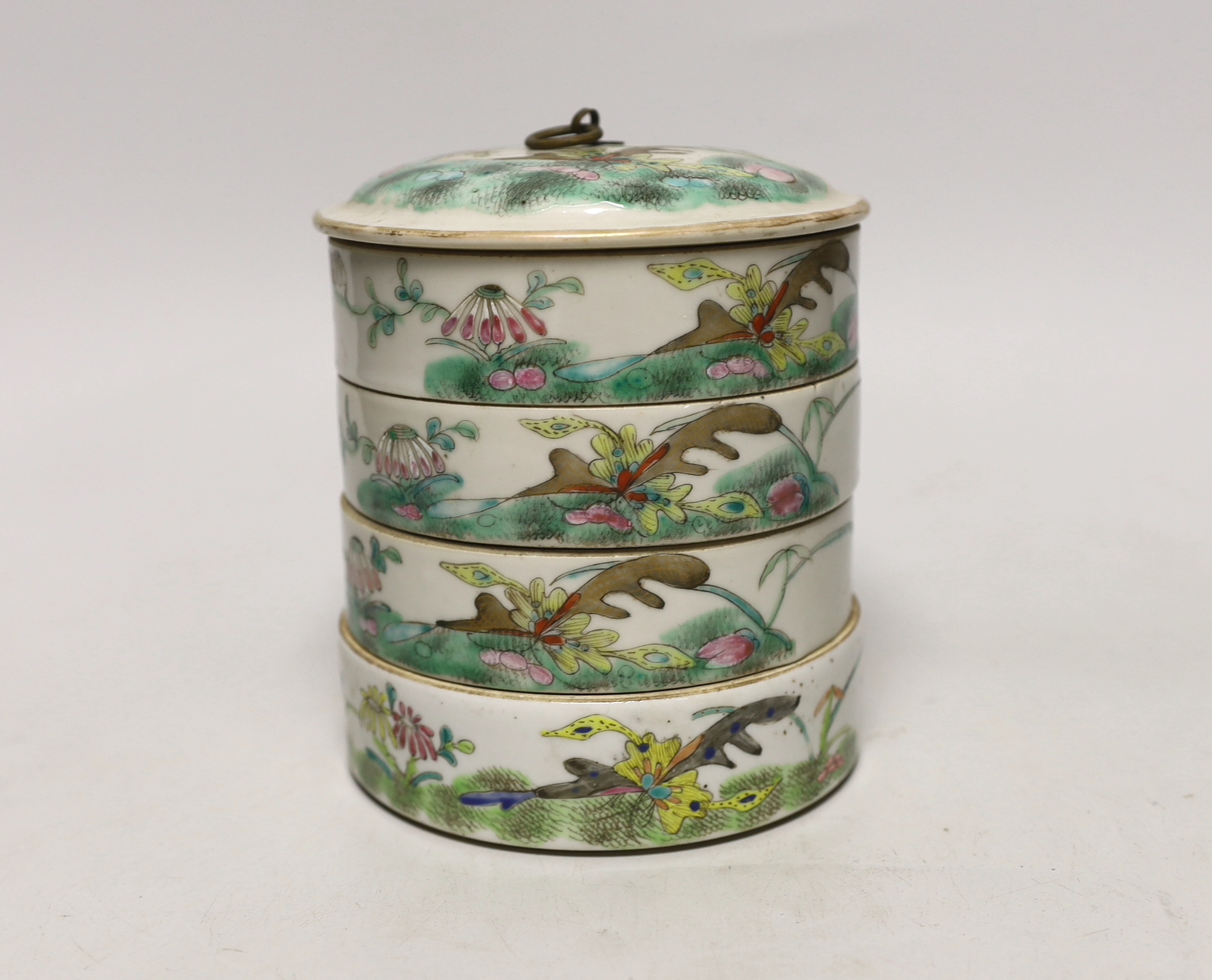 An early 20th century Chinese enamelled porcelain four section stacking food container and cover, 14cm